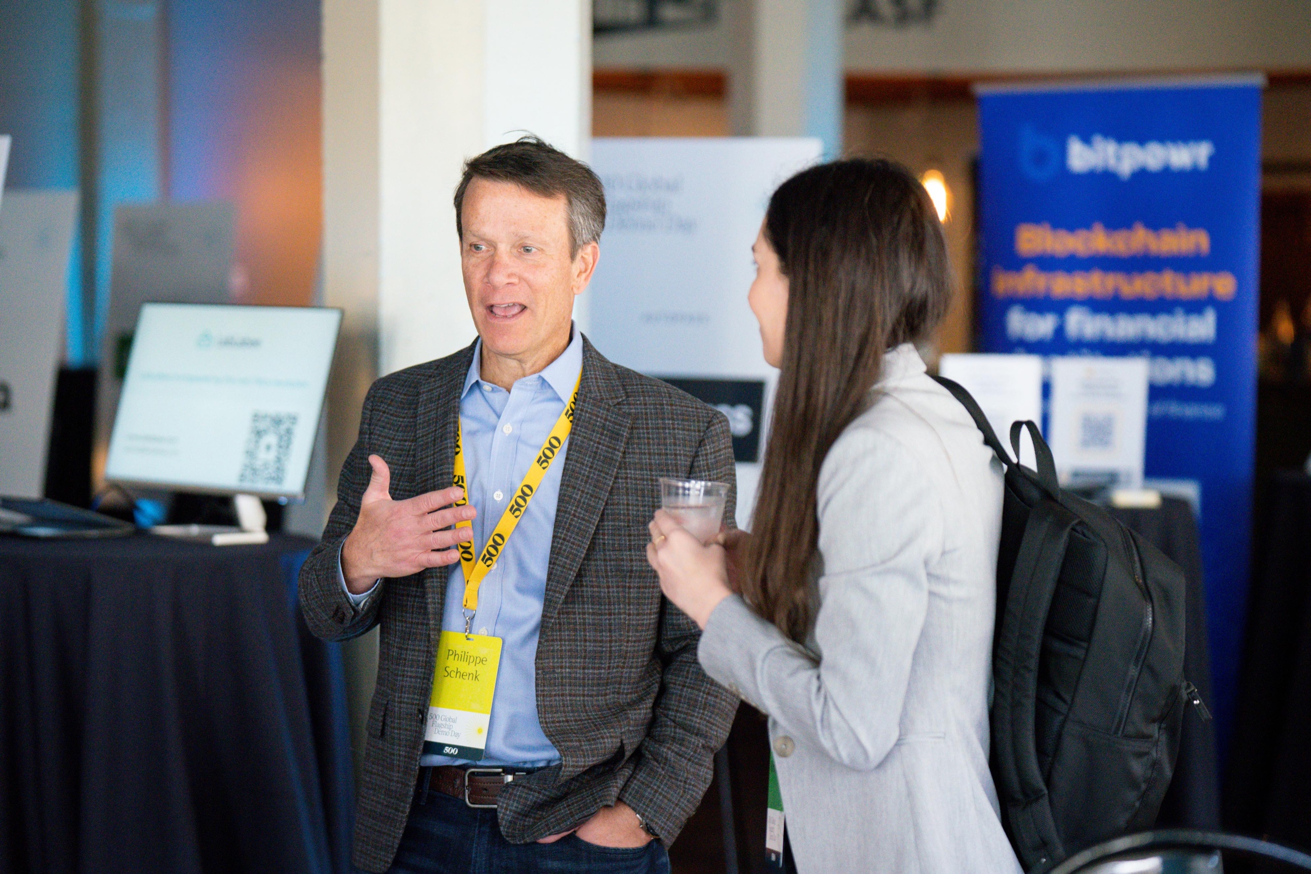 Attendees networking at a conference reception